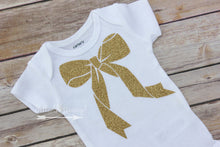 Topped with a bow bodysuit