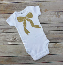 Topped with a bow bodysuit